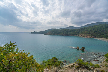 Fototapeta na wymiar the scenic route of lycian trail, between Tekirova and Çıralı is full of amazing bays and beaches with forest and mountains.