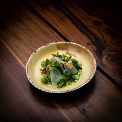 Appetizing salad served in old fashioned dishes.