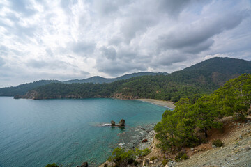 Fototapeta na wymiar the scenic route of lycian trail, between Tekirova and Çıralı is full of amazing bays and beaches with forest and mountains.