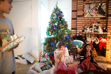 Girls react to their presents at Christmas