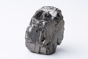 Natural black fossil coal on a white isolated background.