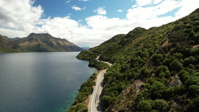 Drone view of scenic drive beside lake. New Zealand beautiful landscape, Lake Wakatipu.