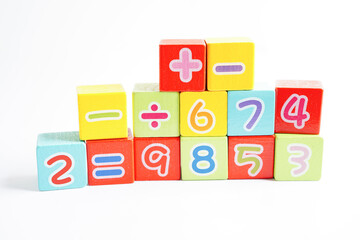 Number wood block cubes for learning Mathematic, education math concept.