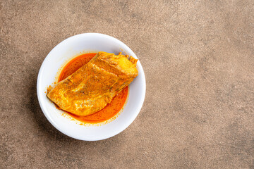 snapper curry fish (gulai ikan kakap) from padang, west sumatera, indonesia