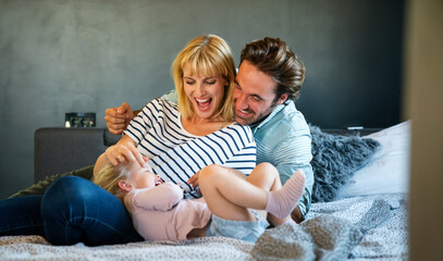 Fototapeta premium Happy family having fun time at home. People love child home concept.
