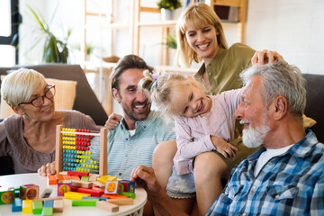 Cheerful multi-generation family having fun while spending time together at home.