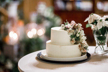 Wedding cake on the decorated table