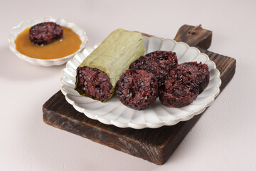 Lemang Ketan Hitam , is an  Indonesian Traditional Food from West Sumatera, Served with Srikaya sauce.