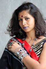 Indian woman wearing chaniya choli for Garba and Dandiya in navratri, wearing oxidized jewelry and...