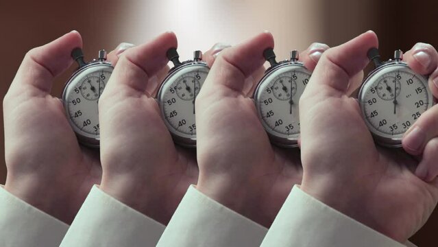 A shot of hands with stopwatches in closeup
