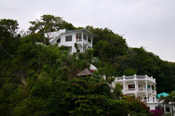 Fototapeta na wymiar Luxurious mansion on a mountainside in the tropical jungle.