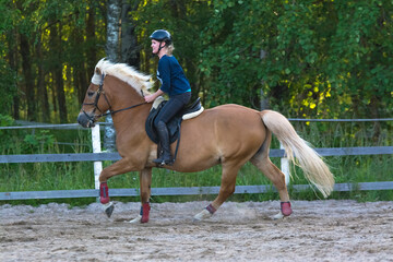 Woman horseback riding 