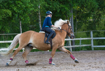 Woman horseback riding 