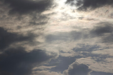 Rainy Clouds. A helicopter in a rainy cloudy sky covering the sun. Clouds Covering Sky.
