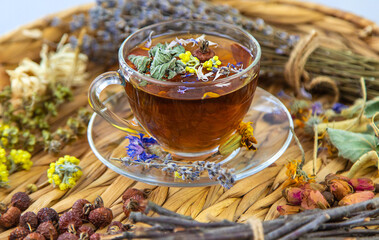 Herbal tea with medicinal herbs and flowers. Selective focus.