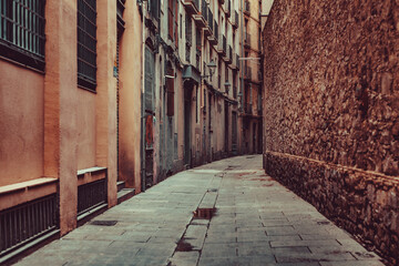Fototapeta na wymiar Narrow street in old town, warm retro style colors