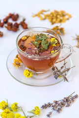 Herbal tea with medicinal herbs and flowers. Selective focus.