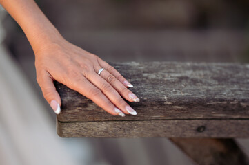 Detail of the newlyweds' hands. Hands of the bride and groom. Wedding photos of rings.