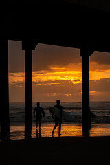 sunrise on the beach surfing