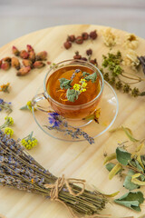 Herbal tea with medicinal herbs and flowers. Selective focus.