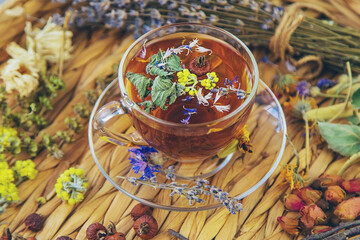 Herbal tea with medicinal herbs and flowers. Selective focus.