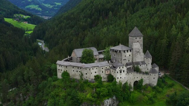 Sensational establisher aerial shot of Taufers Castle in South Tyrol, Italy
