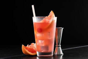Sea breeze cocktail in glass on black background