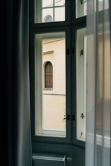 Window view from old European building in Prague