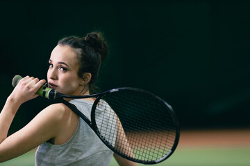 Tennis woman player portrait with racket and ball at court.