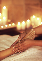 Obraz na płótnie Canvas Be good to your feet. a woman enjoying a foot massage at a spa.