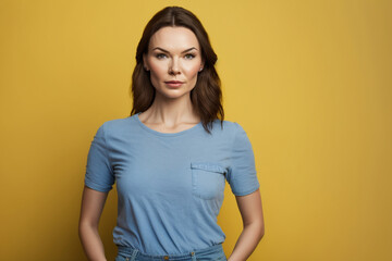 Obraz premium Beautiful caucasian girl standing on a yellow background looking at the camera. AI generative