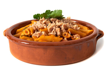 Macaroni pasta with tuna in tomato sauce, served in a clay bowl. Isolated on a white background. Italian food concept.