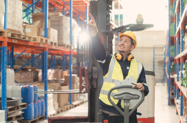 Portrait of warehouse supervisor in a large warehouse with their own preparation for the day's work
