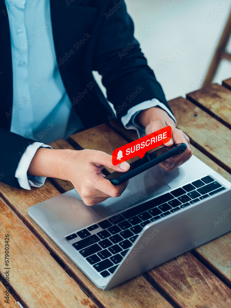 Poster subscription concept. red subscribe button with bell icon appear on smart mobile phone in hands. sma