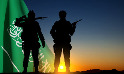 Fototapeta na wymiar SIlhouettes of a soldiers against the sunset sky and Saudi Arabia flag. Concept - Armed Force of Saudi Arabia. National Holidays background. EPS10 vector
