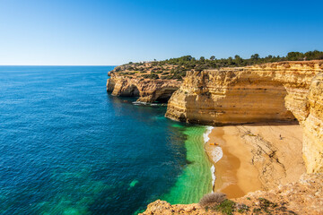Fototapeta na wymiar Beautiful cliffs and beach called Cao Raivoso in Algarve, Portugal