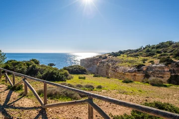 Foto auf Acrylglas Strand Marinha, Algarve, Portugal Beautiful cliffs and rock formations by the Atlantic Ocean in Algarve, Portugal