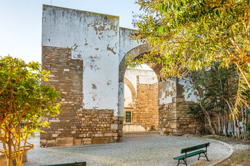 Resting Arch in medieval walls is one of 4 entrances to the old town in Faro, Algarve, Portugal