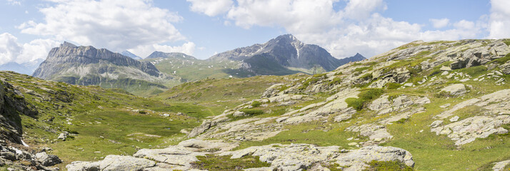 Fototapeta na wymiar Magnificent panoramic mountain landscape during summer under a blue sky