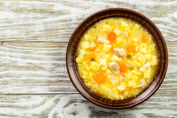Vegan healthy split pea soup on rustic wooden background. Top view, copy space.
