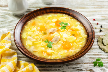 Creamy split  pea soup on rustic wooden background. Top view, copy space.