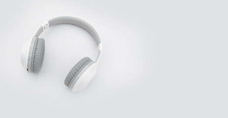 white wireless headphones on a white background using Bluetooth headphones to connect.