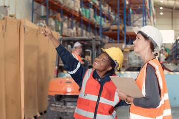 Warehouse foreman and employees Check the imported products in the central warehouse. before delivering to each region's distribution centers