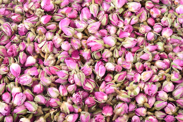 Rose buds background texture. Floral background. Naturally dried rose buds.