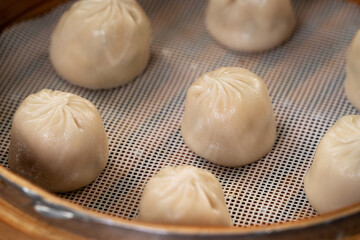 Steamed pork soup dumplings named Xiao long bao in Taiwan.