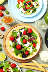Concept of tasty salad, salad with strawberry, top view