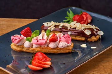 Set of french dessert eclairs with colorful topping