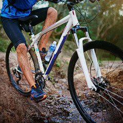 Fototapeta premium Owning this trail. a male cyclist riding along a mountain bike trail.
