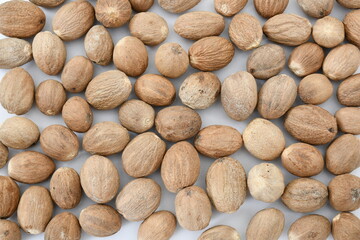 Organic Nutmeg whole background stock images. top view