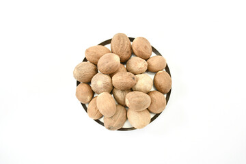 Organic Nutmeg whole on white background stock images. top view